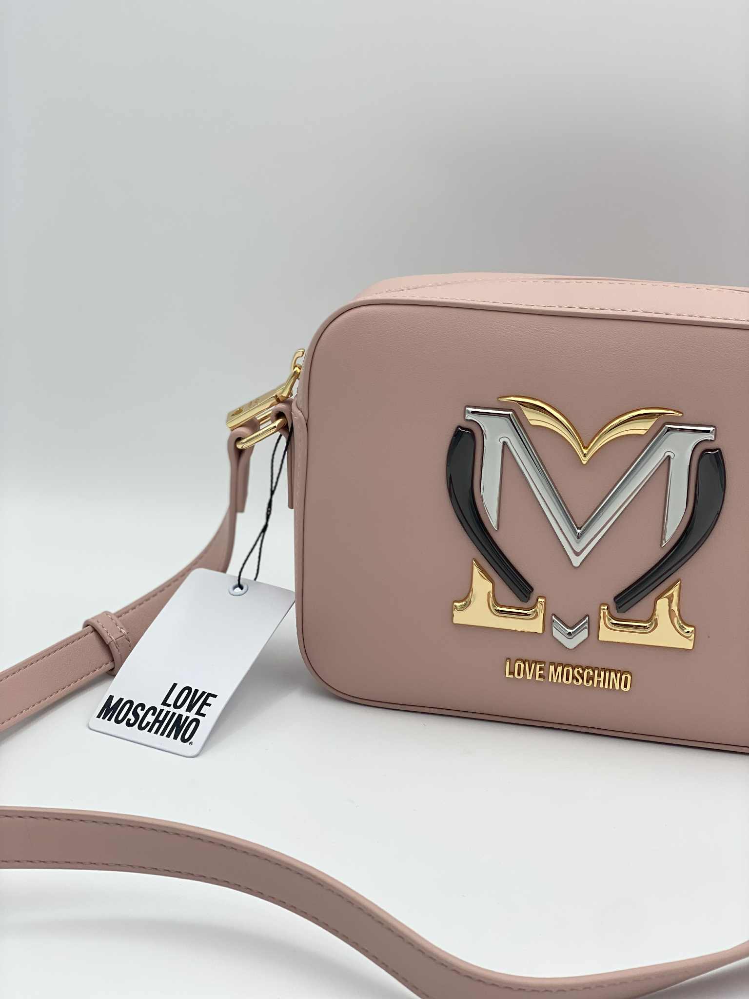 Crossbody bag in faux leather with metal logo